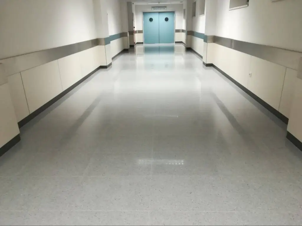 Hospital corridor with well-maintained floors.