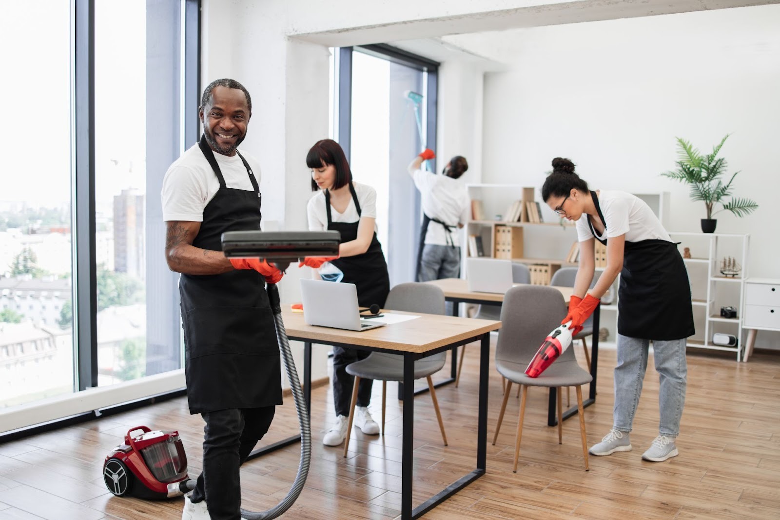 Janitorial professionals actively cleaning an office to maintain a clean and organized workspace