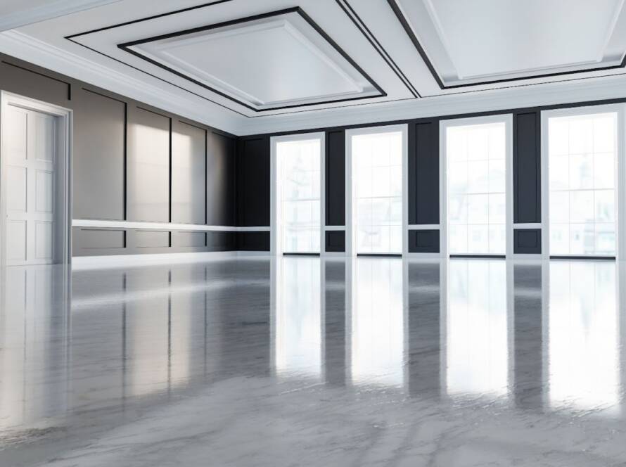 Empty commercial lobby highlighting professionally refinished vinyl flooring with a bright, reflective finish