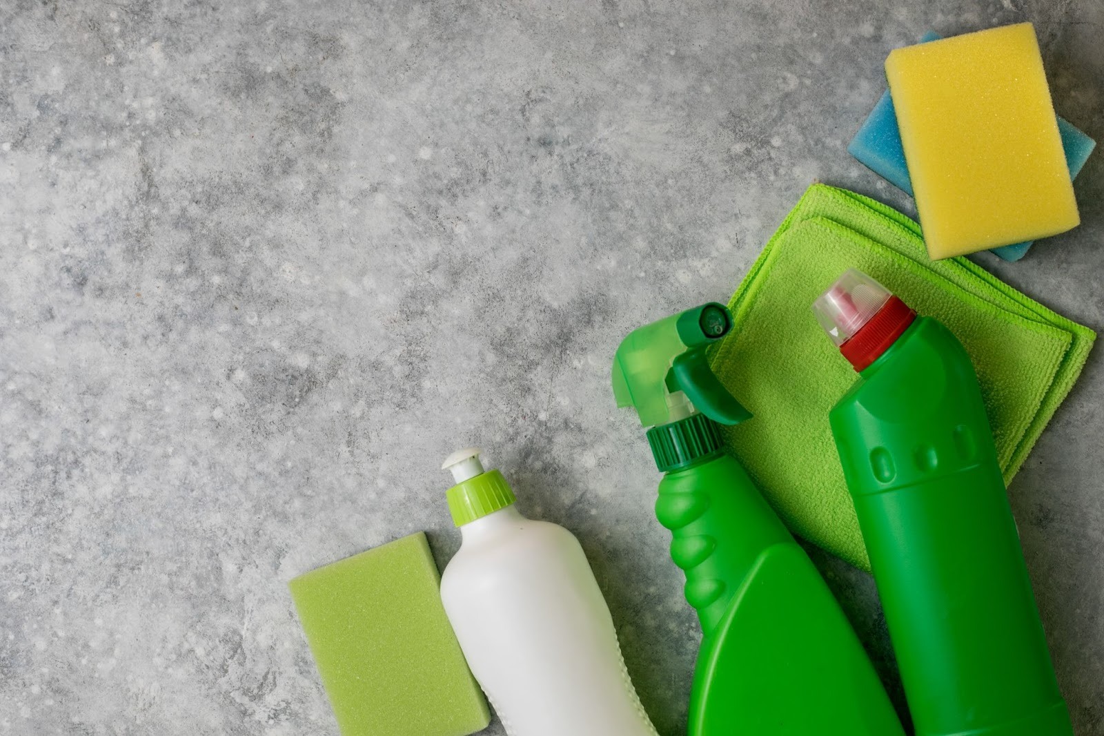 Green-cleaning supplies with reusable plastic detergent bottles and sustainable tools